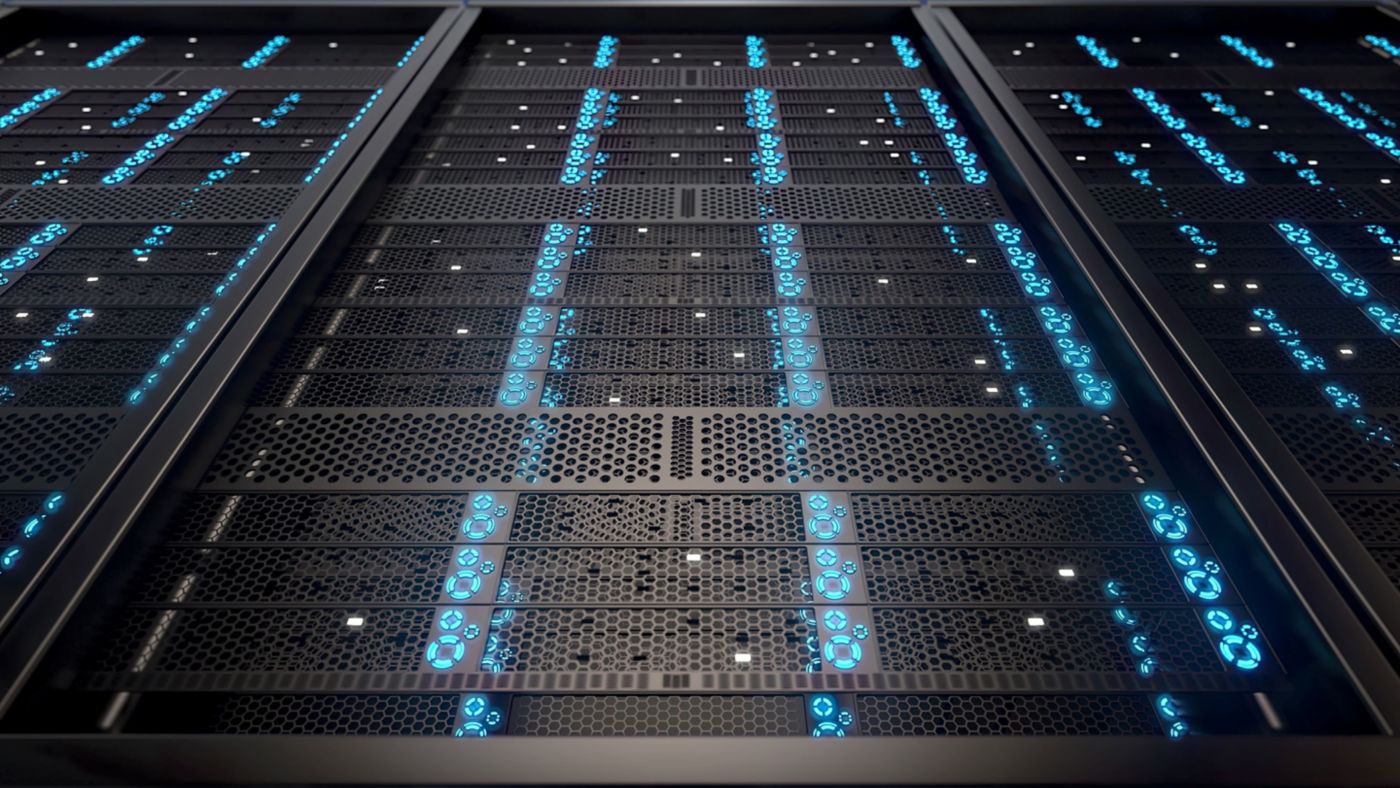 A close-up view of server racks in a data center, featuring blue illuminated lights and a sleek design.
