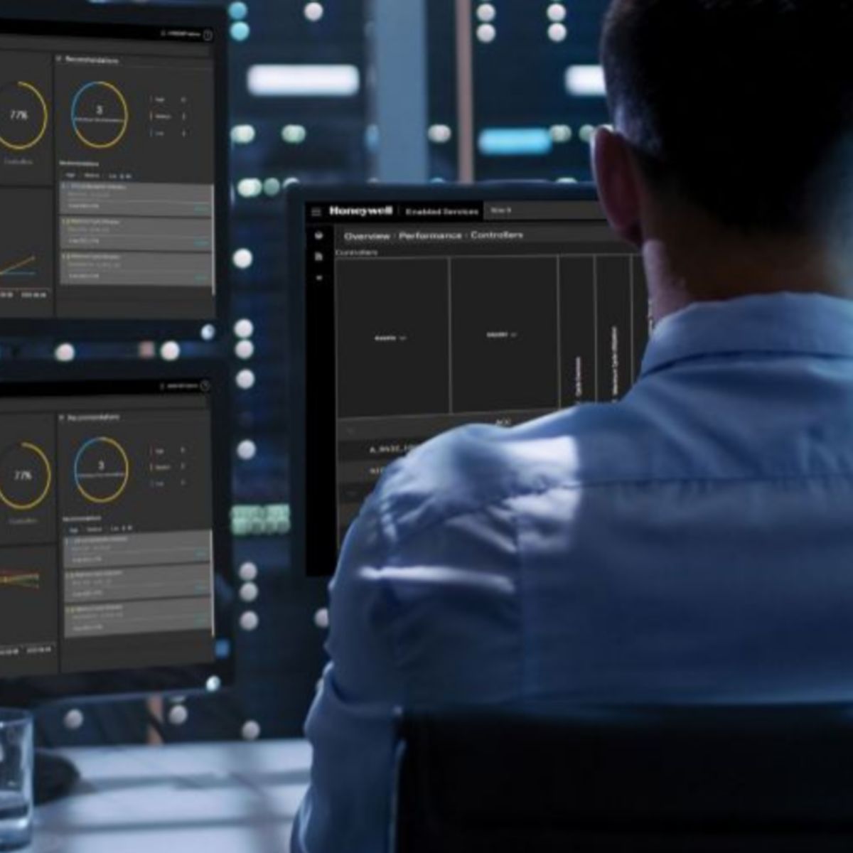Operator monitoring industrial systems through advanced dashboards, enabling real-time data analysis, performance tracking, and operational efficiency in critical environments.