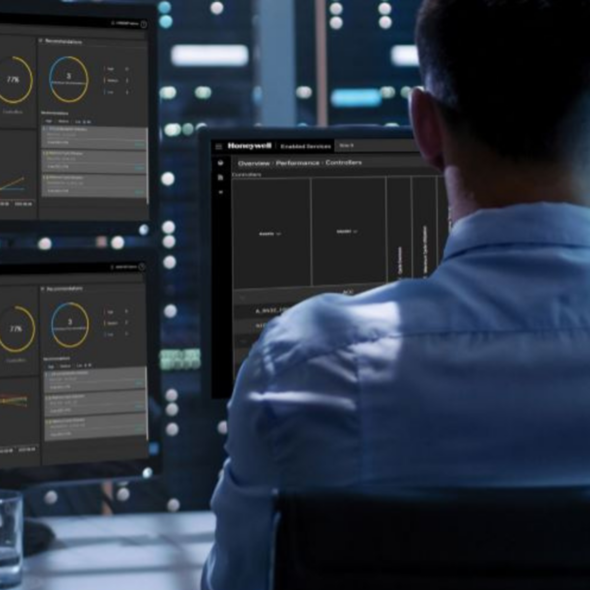 Operator monitoring industrial systems through advanced dashboards, enabling real-time data analysis, performance tracking, and operational efficiency in critical environments.