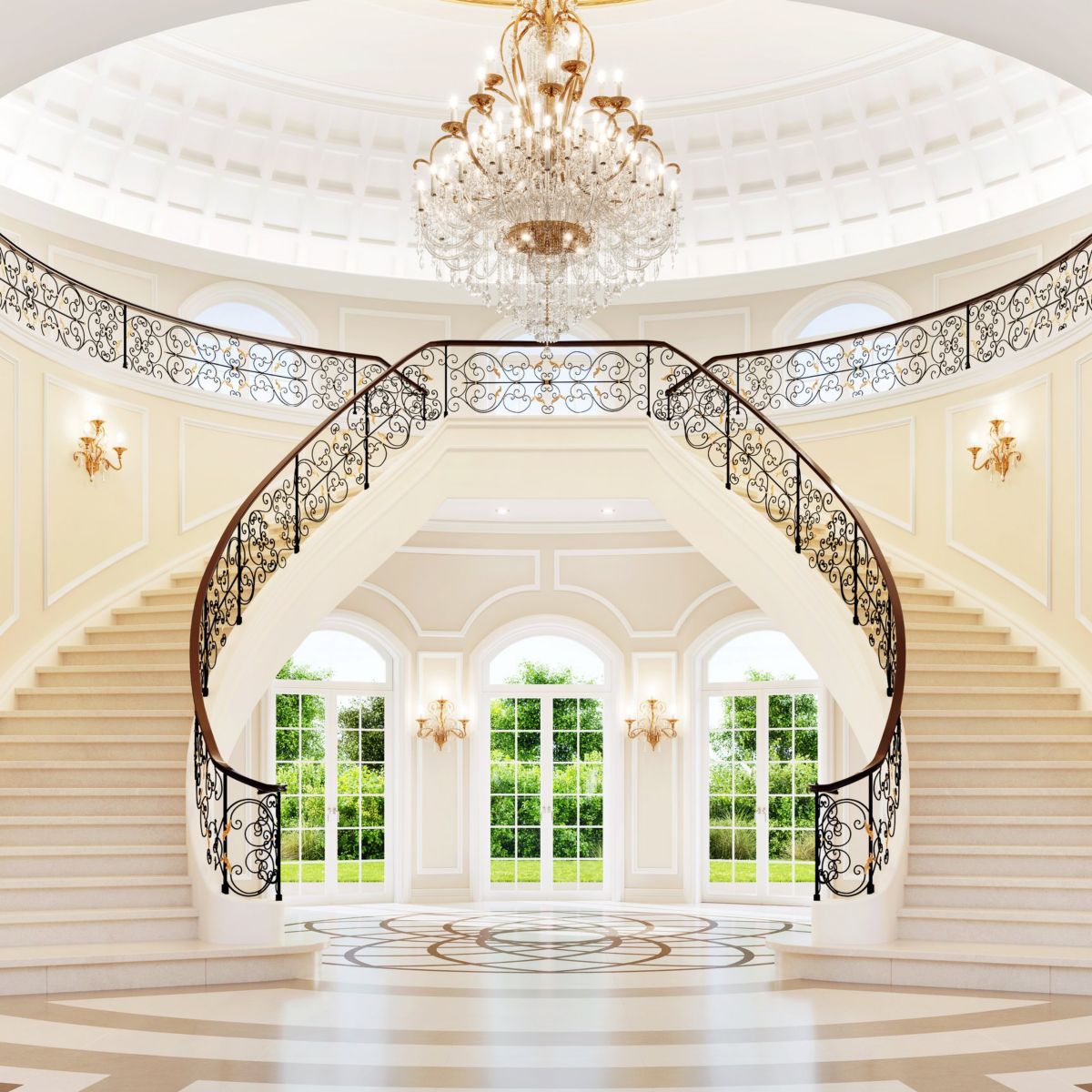 A symmetric, opulent foyer features a sweeping double staircase, crystal chandelier, and marble flooring bathed in natural light from arched windows.