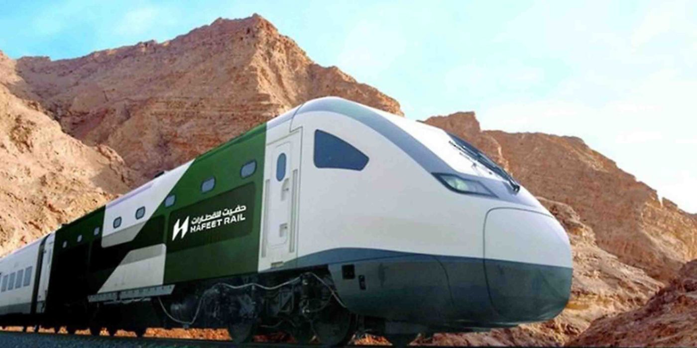 Modern Hafeet Rail train traveling through a rugged mountain landscape, showcasing regional rail transport