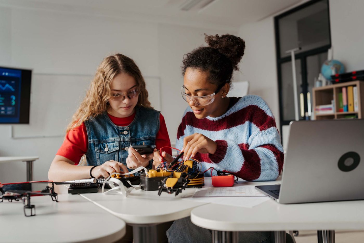 High school students working on robotics project. Girls in STEM.