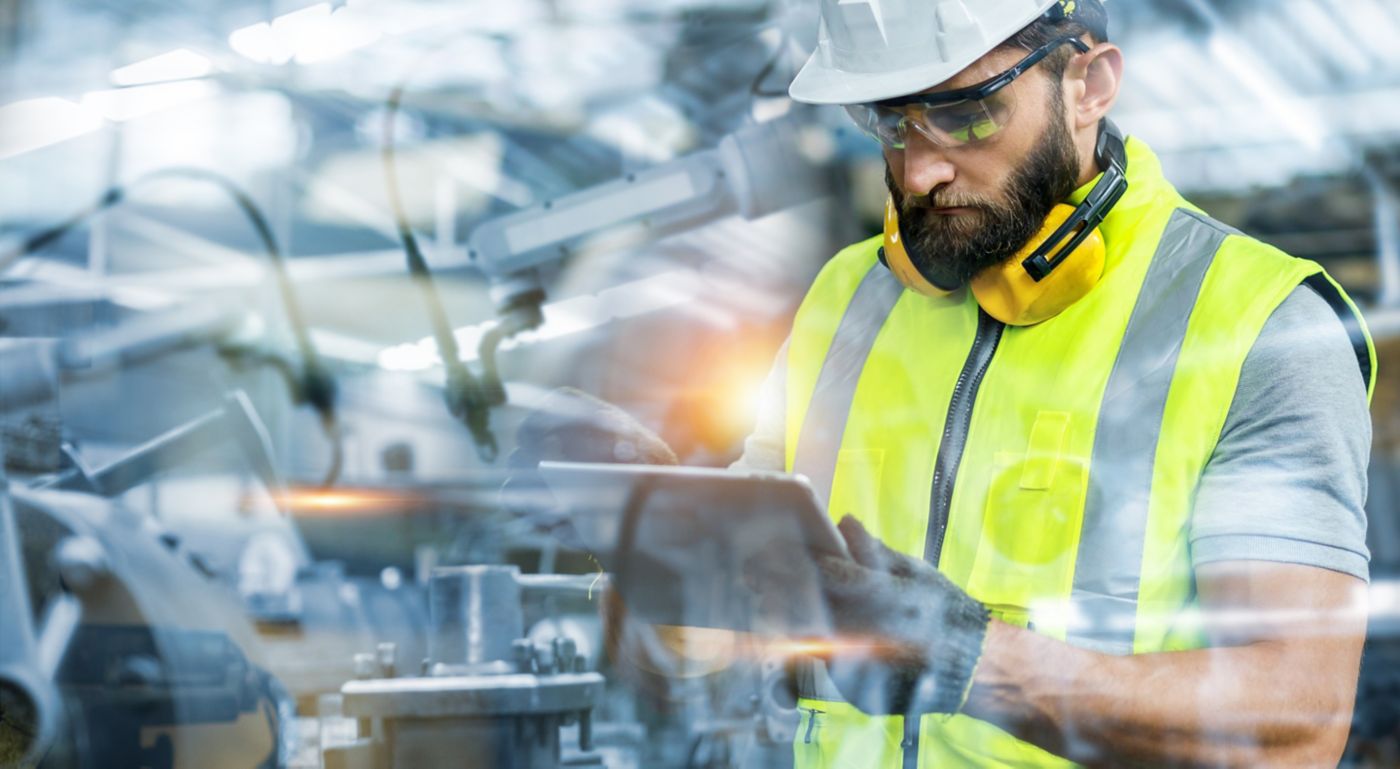 Manager or Industrial engineer working and control robotic with industry factory and network connection automation robot arm by tablet. AI, Artificial intelligence.