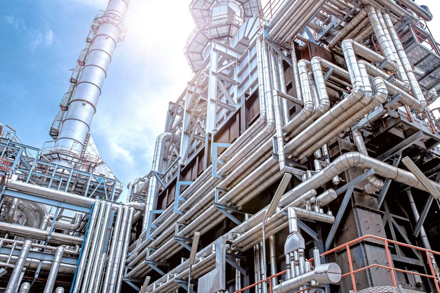 Oil and gas refinery plant form industry petroleum zone,Refinery equipment pipeline steel and oil storage tank at sunrise. -image