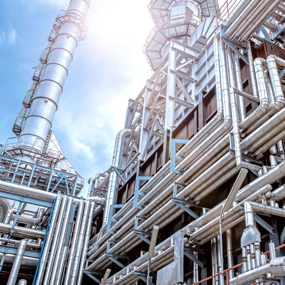 Oil and gas refinery plant form industry petroleum zone,Refinery equipment pipeline steel and oil storage tank at sunrise. -image