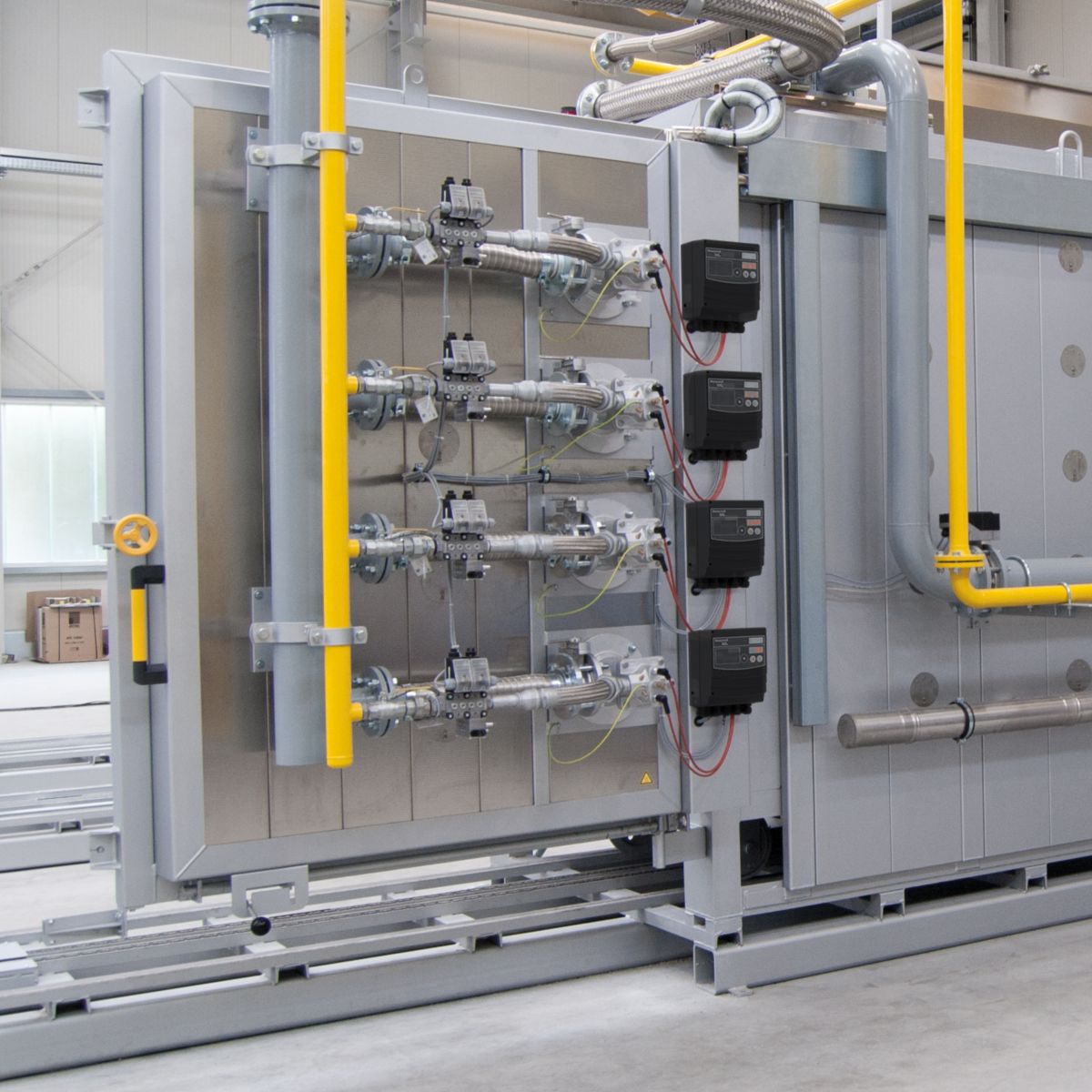 Integrated industrial system with burners and heat exchangers, designed to optimize heat transfer, improve fuel efficiency, and enhance overall thermal performance.