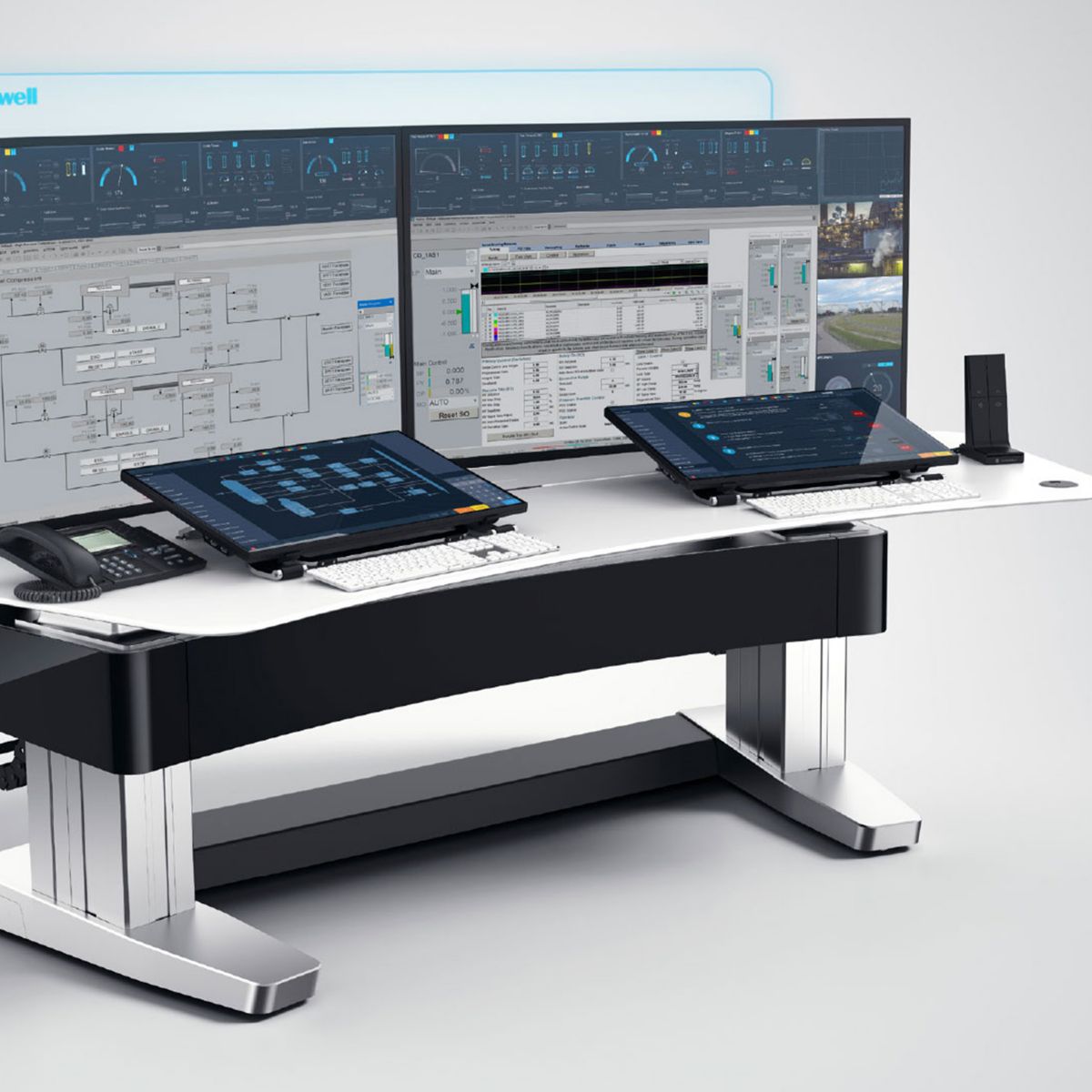 Advanced industrial control system workstation called Experion PKS with multiple displays and interfaces designed for monitoring and managing complex operations.