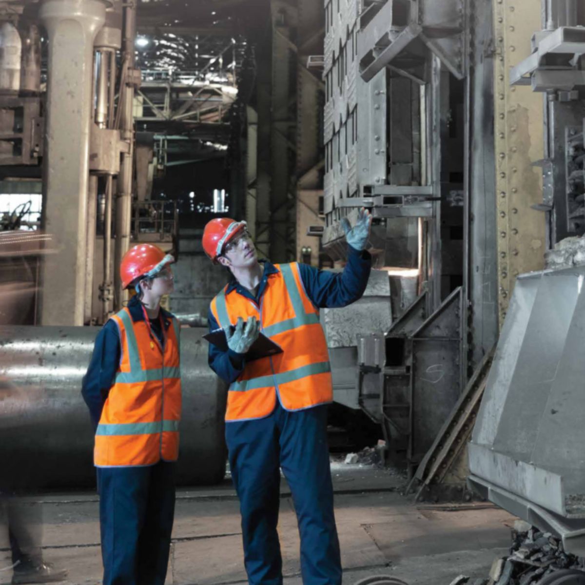 Engineers inspecting an industrial furnace system, ensuring efficient thermal performance, safe operation, and optimized heat management in high-temperature environments.