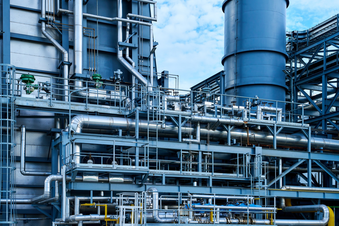 Complex network of pipelines and tanks located within a power generation plant, illustrating the intricacies of industrial infrastructure and the processes of energy production