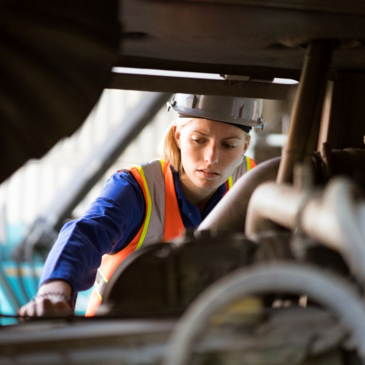Engineer inspecting industrial machinery and thermal systems, supporting maintenance, efficiency, and reliable performance in high-demand operational environments.