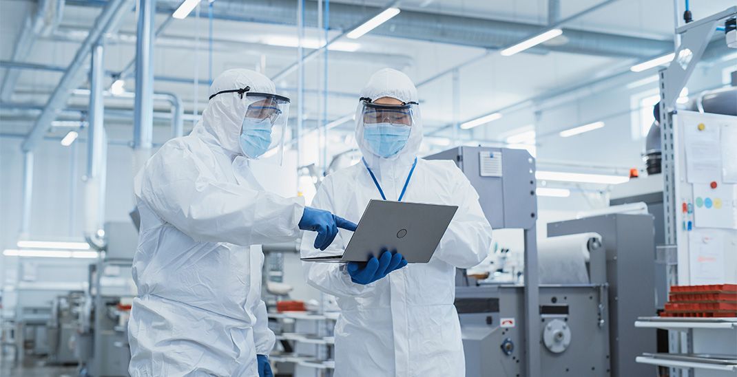 Digital manufacturing environment where personnel use connected technology to support efficient life sciences production and operations.