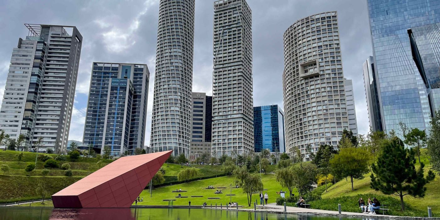 Discover Mexico City’s modern Santa Fe skyline with sleek high-rise towers and a vibrant urban park blending nature and contemporary architecture.