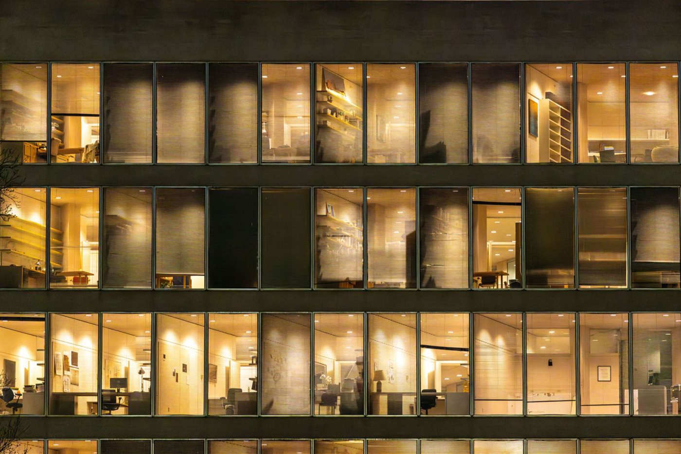 hon-office-building-illuminated-windows-night-2207367150.jpg