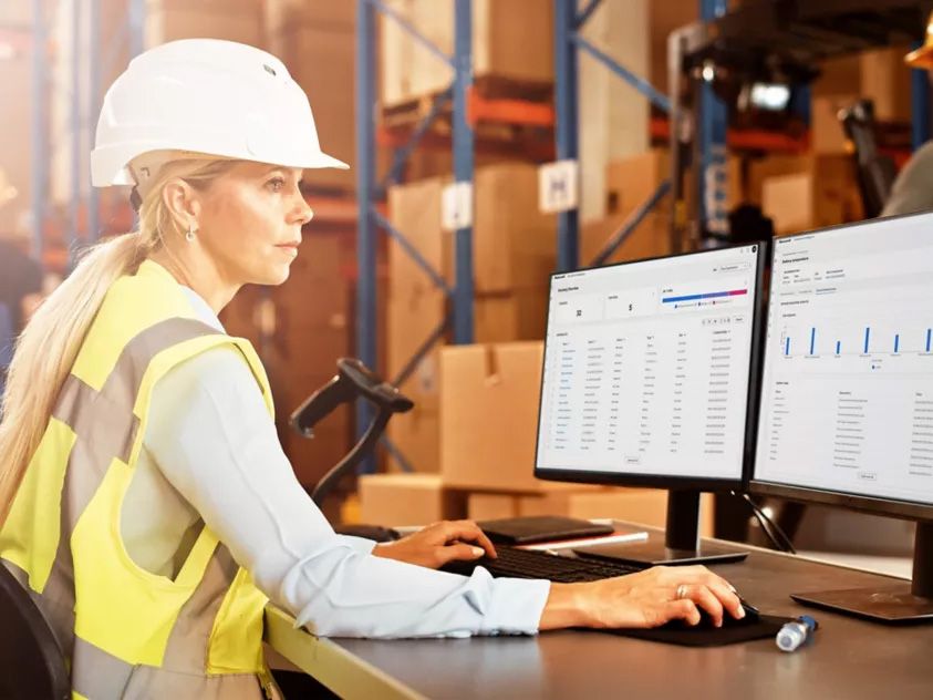 Warehouse operator using analytics dashboards to monitor mobile assets, improve productivity, and gain real-time operational insights across distribution and logistics environments.