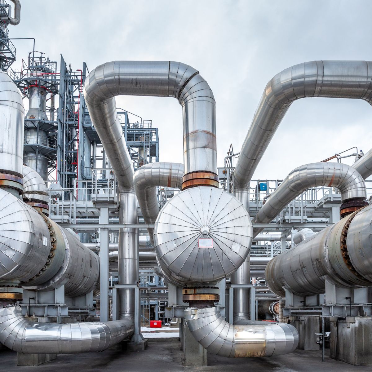 Extensive refinery piping and heat exchanger network designed for optimized heat transfer, improved energy efficiency, and reliable thermal management in industrial operations.
