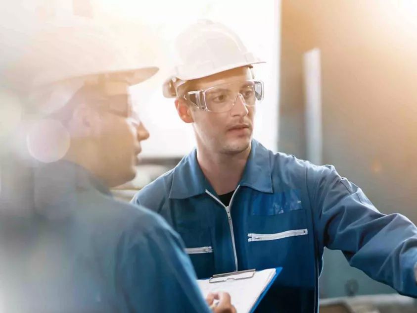 Engineering professionals reviewing facility operations and safety systems, supporting toxic gas detection, risk mitigation, and regulatory compliance in semiconductor manufacturing environments.
