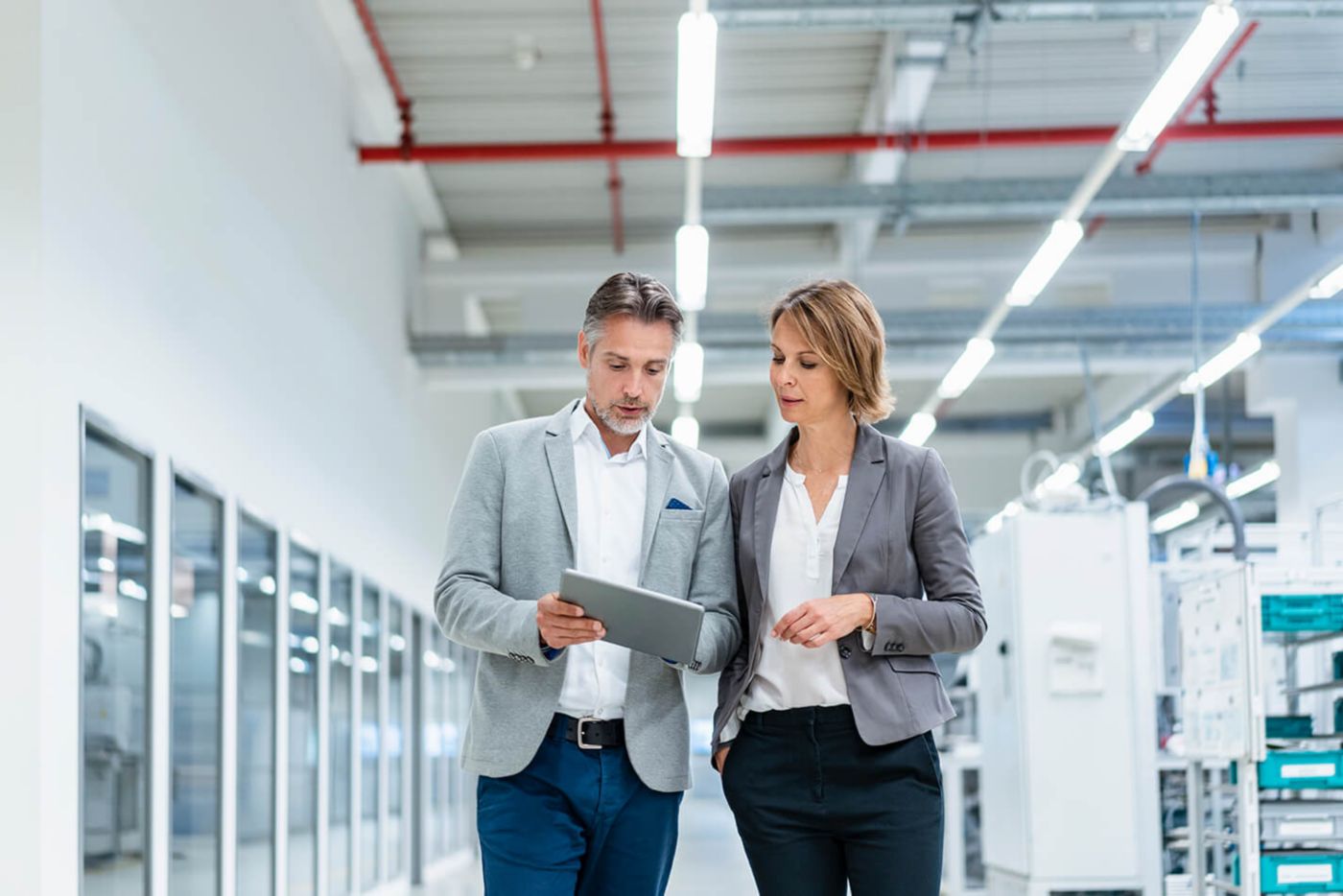 Two consultants looking at a tablet