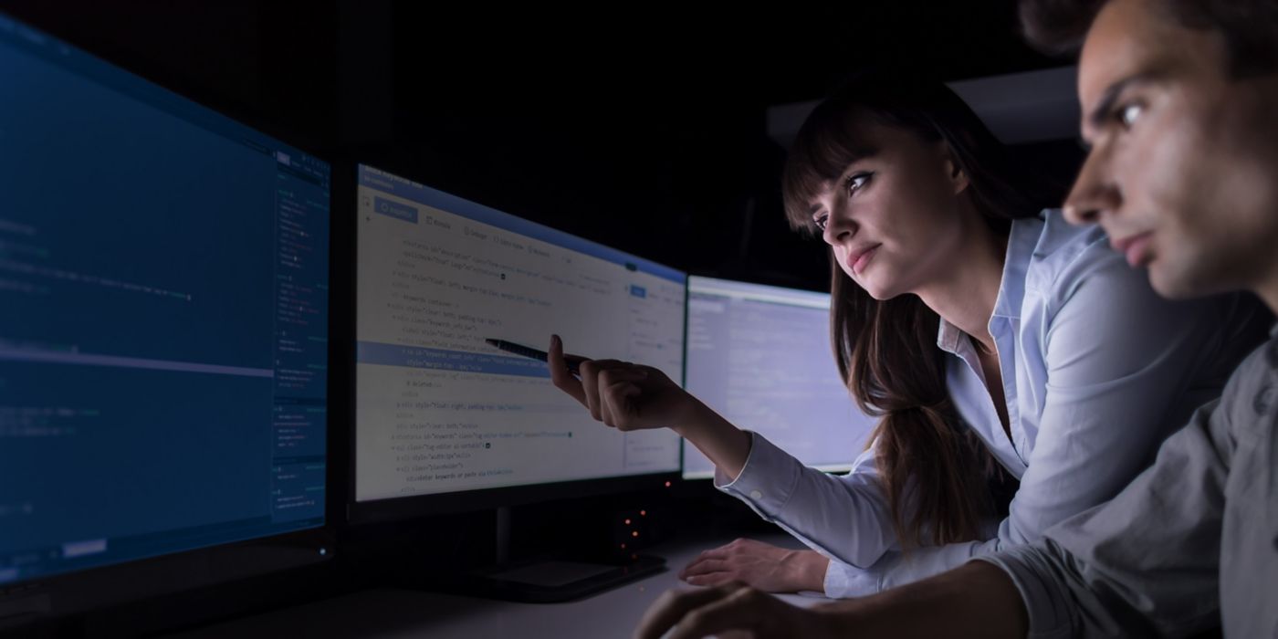 Two people looking at computer screen