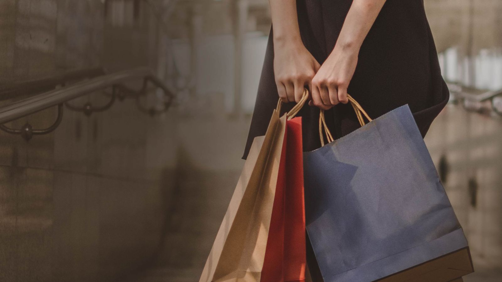 Woman holding two shopping bags
